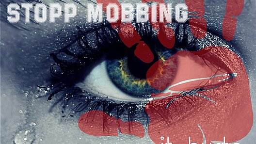 Stopp Mobbing Auge mit einer Träne, darüber steht Stopp Mobbing, darunter it hurt´s